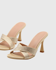 Natalina Rhinestone Cross Flared Heels In Gold
