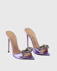 Rina Crystal Bow Snake Mules In Purple