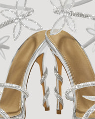 Zana Rhinestone Bow Snake Sandals In Silver