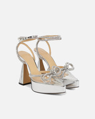 Rina Crystal Bow Platform Flared Heels In Silver