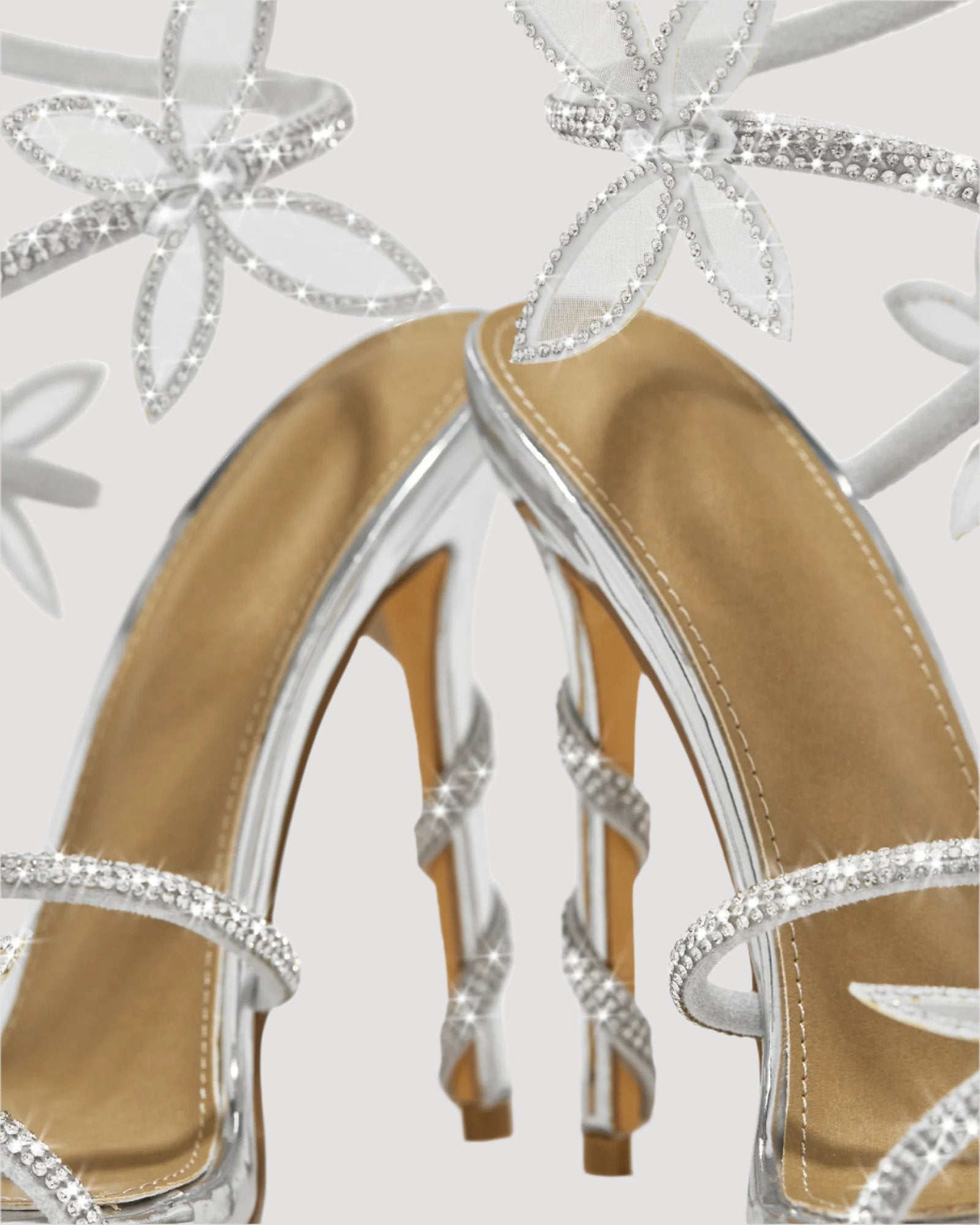 Zana Rhinestone Bow Snake Sandals In Silver