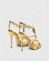 Pia Rhinestone Scorpion Strap Sandals In Gold
